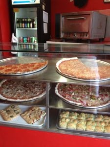 Pizza by the slice at East Side Pies