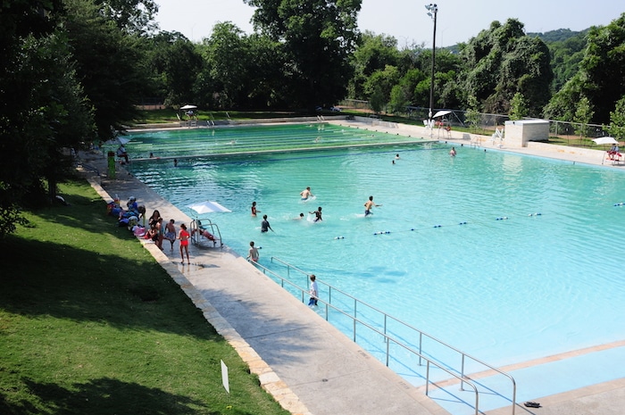 People swimming in Austin's Deep Eddy Pool