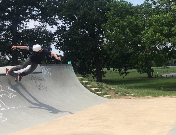 Skateboarder in concrete quarter pipe at Austin's Patterson Park