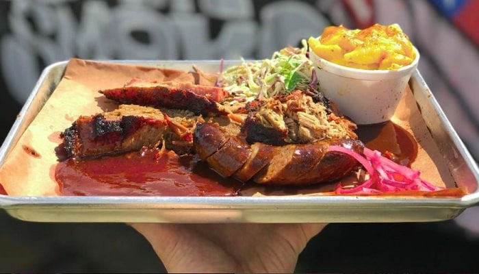 For delicious flavors and Insta-worthy meat pics, head to Rollin' Smoke (Credit: Rollin' Smoke's Instagram)