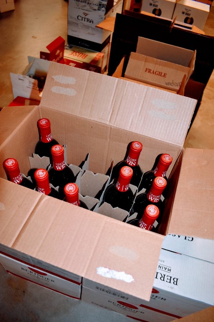 Box half filled with wine at Utopian Shift in Austin