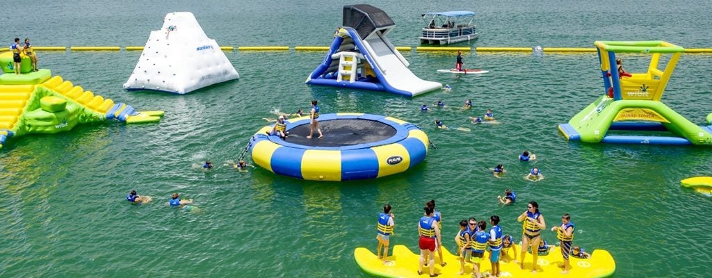 Waterloo Adventures Aqua Park With giant floating trampoline and water slide on lake
