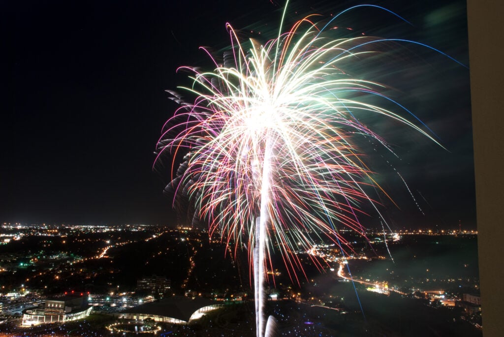 Star-Spangled Fest 4th of July fireworks over Austin skyline at night, view from above
